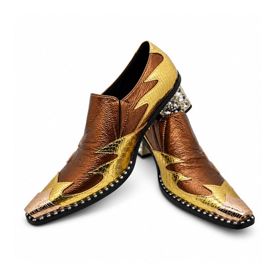 A pair of men's metallic gold and bronze slip-on western dress shoes with a pointed metal toe and a rhinestone-studded block