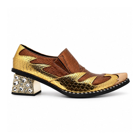 A pair of men's metallic gold and bronze slip-on western dress shoes with a pointed metal toe and a rhinestone-studded block