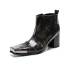 Pair of shiny black square toe ankle boots with metal tip and block heels