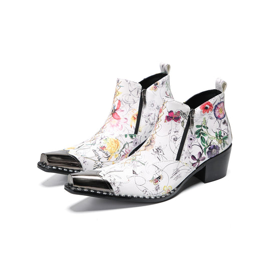 Pair of men's white genuine leather ankle boots with a colorful floral print and shiny metallic pointed toe caps.