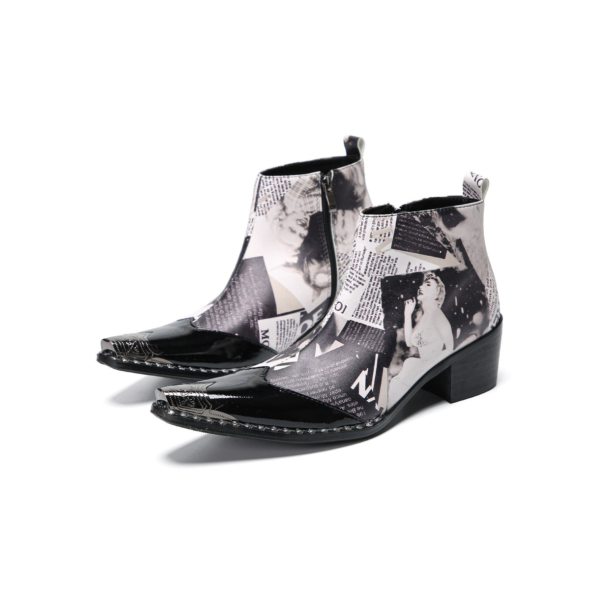 Pair of Aomishoes men's newspaper print ankle boots with pointed patent leather toe caps and side zippers on a white