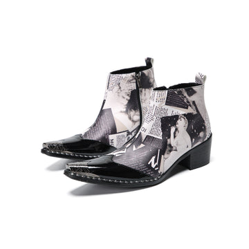 Pair of Aomishoes men's newspaper print ankle boots with pointed patent leather toe caps and side zippers on a white