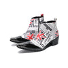 Pair of Aomishoes newspaper print and Union Jack pointed toe ankle boots with black patent leather toe caps and block heels.