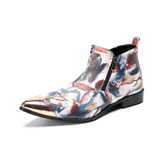 A pair of men's abstract print ankle boots with a gold metal cap toe and side zipper, shown against a white background.