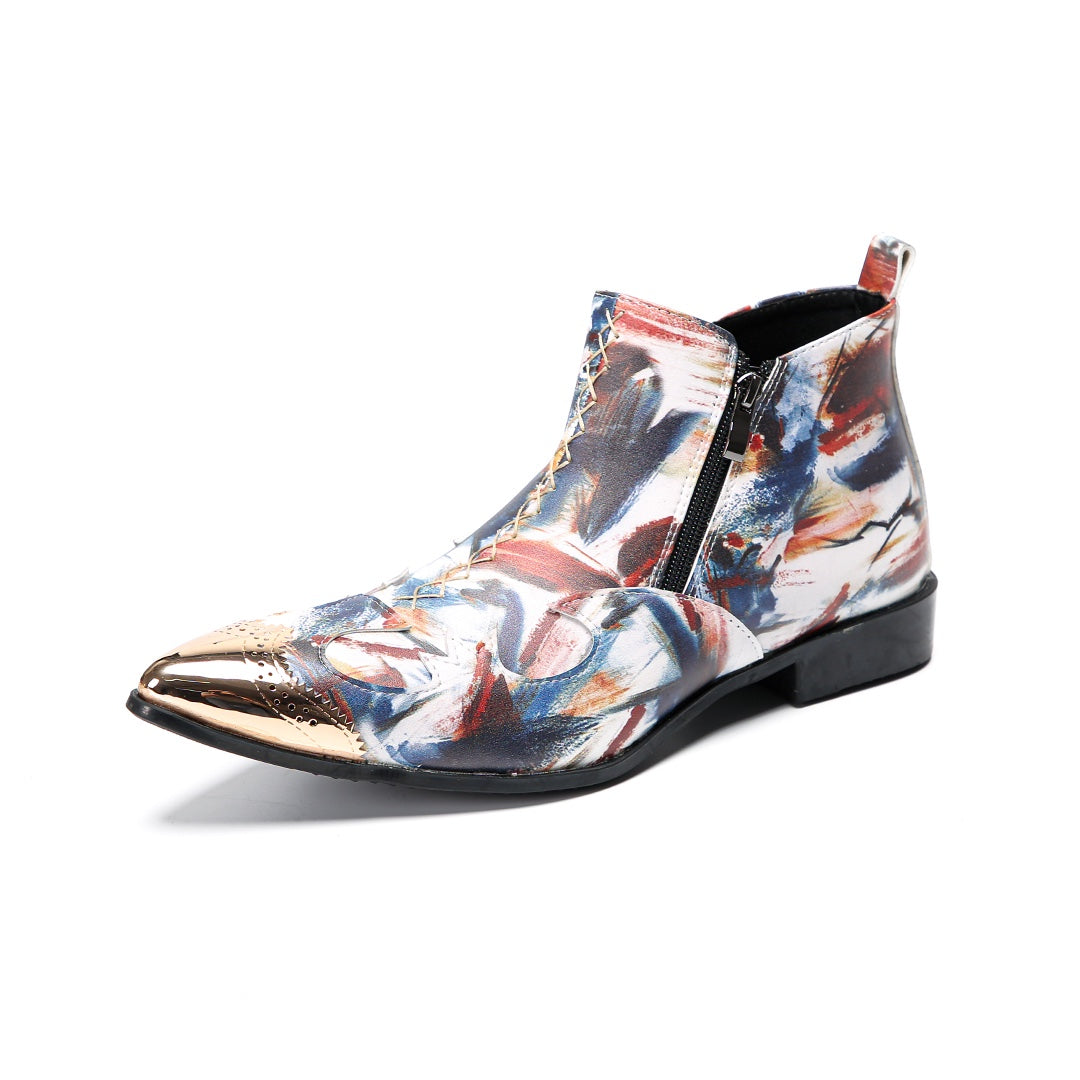 A pair of men's abstract print ankle boots with a gold metal cap toe and side zipper, shown against a white background.