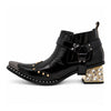 Black patent leather men's pointed toe ankle boot with metal toe cap, studded details, and a gold rhinestone-embellished