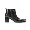 Pair of shiny black square toe ankle boots with metal tip and block heels