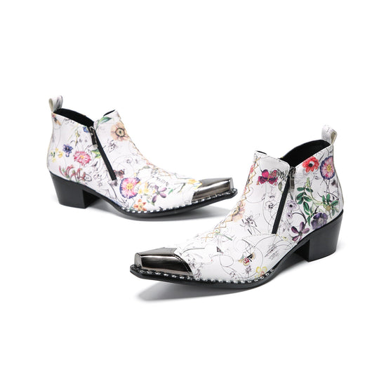 Pair of men's white genuine leather ankle boots with a colorful floral print and shiny metallic pointed toe caps.