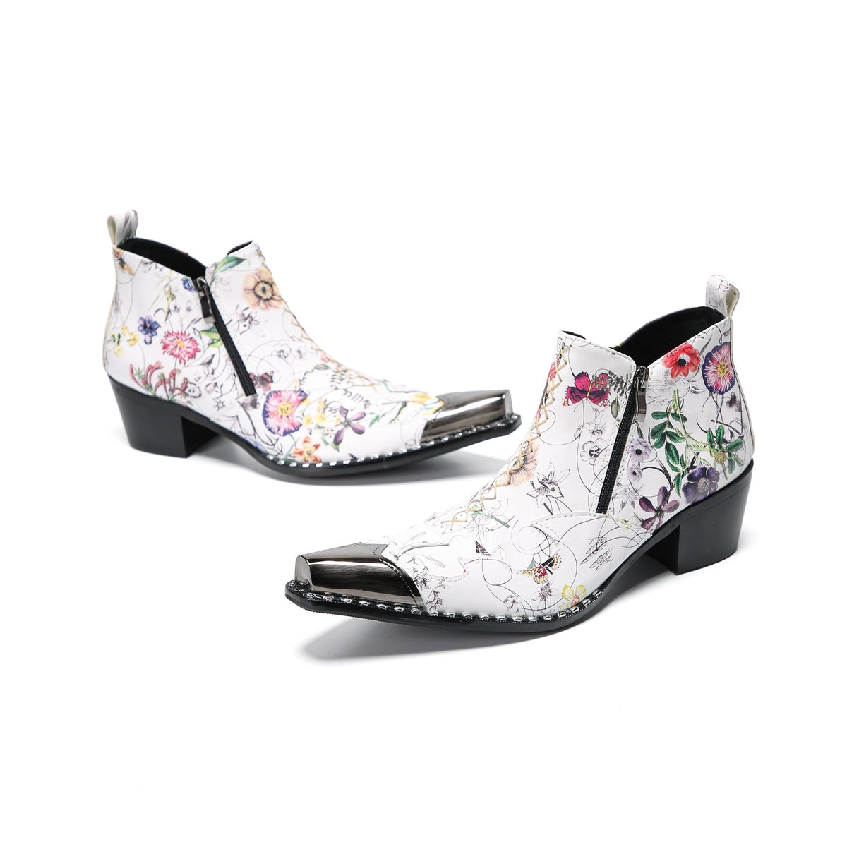 Pair of men's white genuine leather ankle boots with a colorful floral print and shiny metallic pointed toe caps.