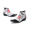 Pair of Aomishoes newspaper print and Union Jack pointed toe ankle boots with black patent leather toe caps and block heels.