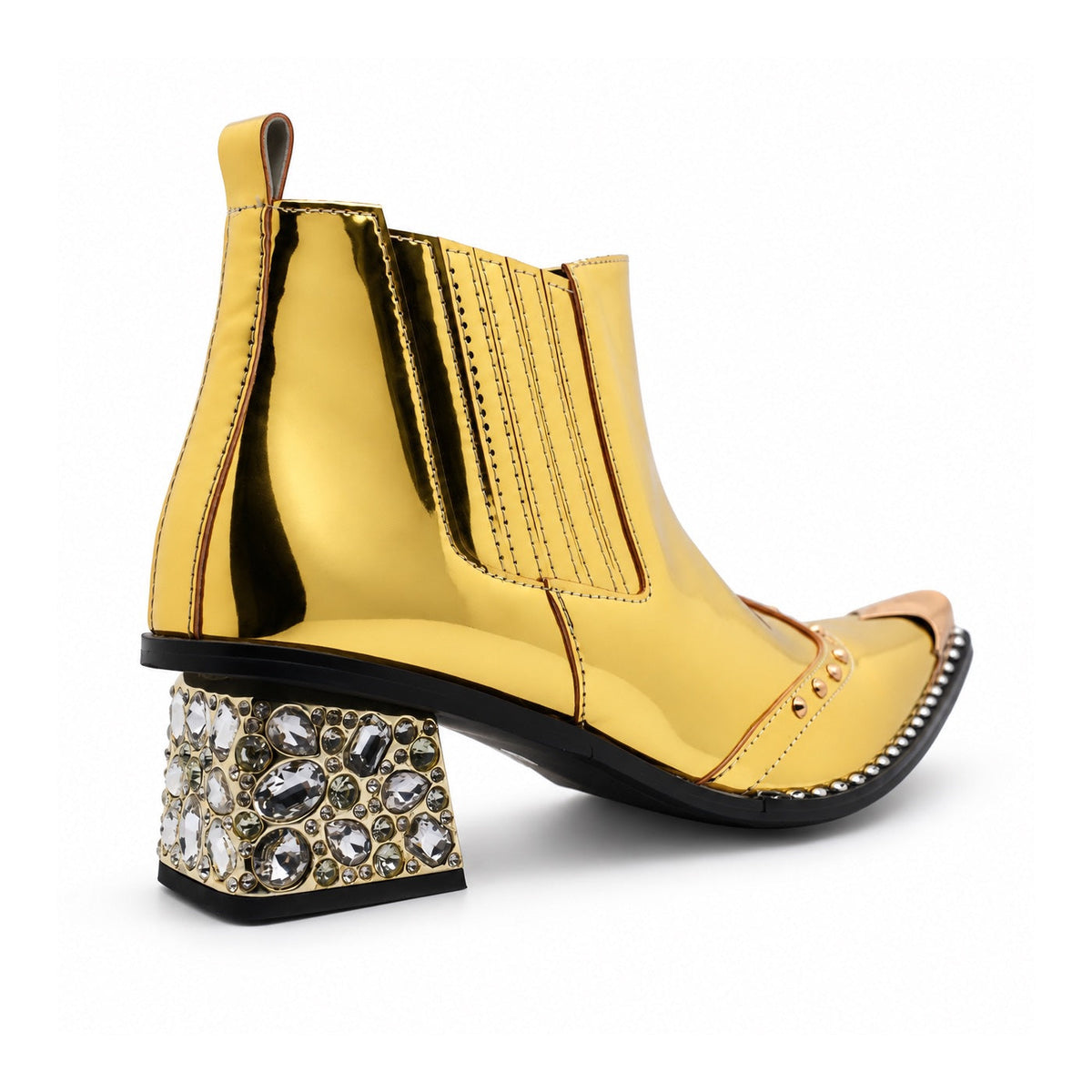 Pair of Aomishoes metallic gold studded ankle boots with pointed metal toe caps and rhinestone embellished block heels on a