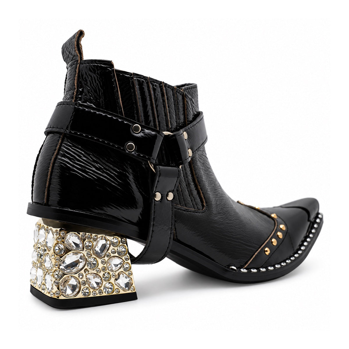 Black patent leather men's pointed toe ankle boot with metal toe cap, studded details, and a gold rhinestone-embellished
