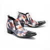 Pair of men's abstract print ankle boots with black leather pointed toe and metal tip, side zippers, and black block heels.