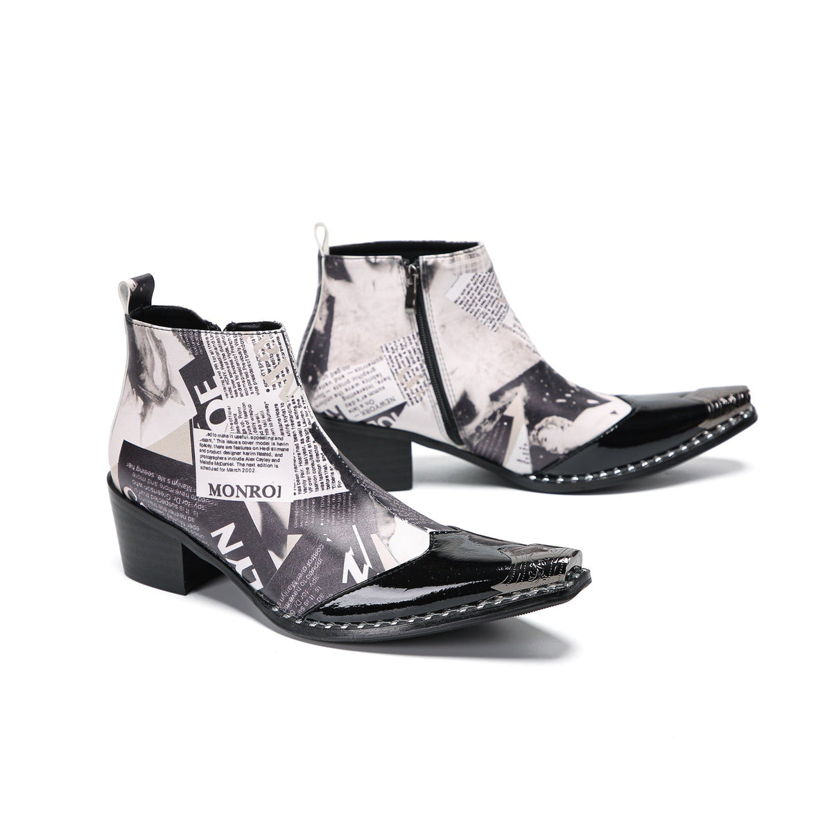 Pair of Aomishoes men's newspaper print ankle boots with pointed patent leather toe caps and side zippers on a white