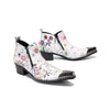 Pair of men's white genuine leather ankle boots with a colorful floral print and shiny metallic pointed toe caps.