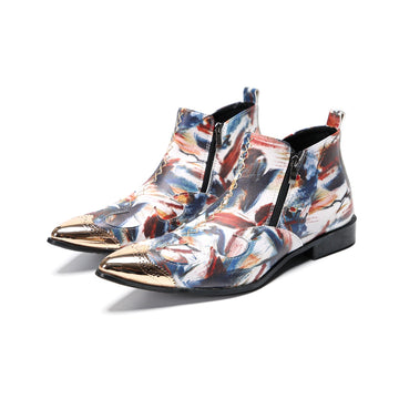 A pair of men's abstract print ankle boots with a gold metal cap toe and side zipper, shown against a white background.