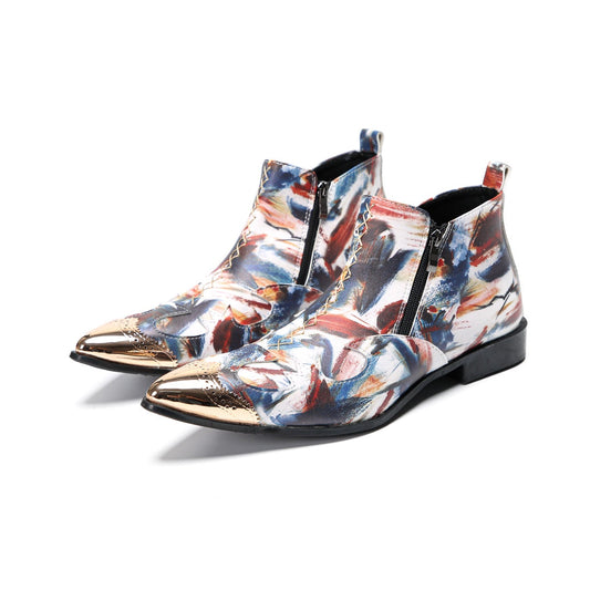 A pair of men's abstract print ankle boots with a gold metal cap toe and side zipper, shown against a white background.