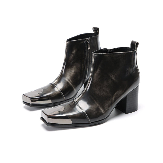 Pair of shiny black square toe ankle boots with metal tip and block heels