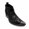Black patent leather men's pointed toe ankle boot with metal toe cap, studded details, and a gold rhinestone-embellished