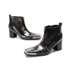 Pair of shiny black square toe ankle boots with metal tip and block heels