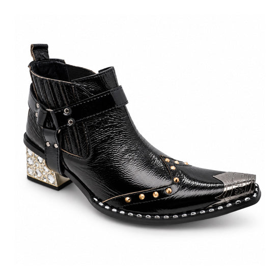 Black patent leather men's pointed toe ankle boot with metal toe cap, studded details, and a gold rhinestone-embellished