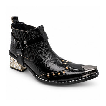 Black patent leather men's pointed toe ankle boot with metal toe cap, studded details, and a gold rhinestone-embellished