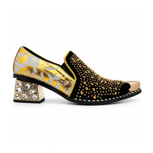A pair of men's black studded loafers with a gold metal toe cap, a gold and grey patterned upper, and a crystal-embellished