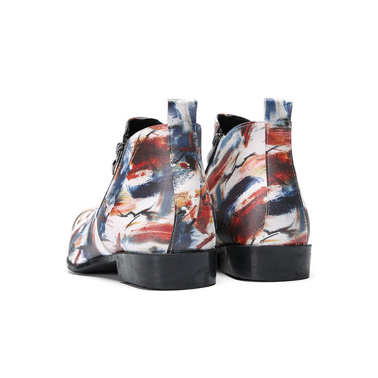 A pair of men's abstract print ankle boots with a gold metal cap toe and side zipper, shown against a white background.