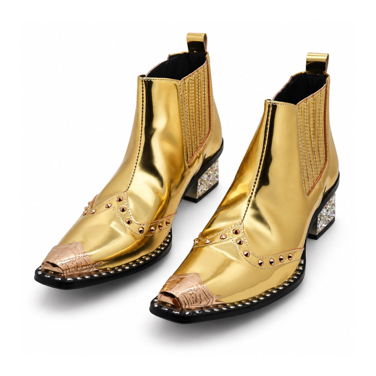 Pair of Aomishoes metallic gold studded ankle boots with pointed metal toe caps and rhinestone embellished block heels on a