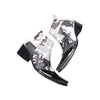 Pair of Aomishoes men's newspaper print ankle boots with pointed patent leather toe caps and side zippers on a white