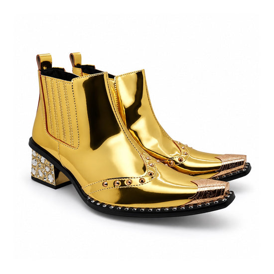 Pair of Aomishoes metallic gold studded ankle boots with pointed metal toe caps and rhinestone embellished block heels on a