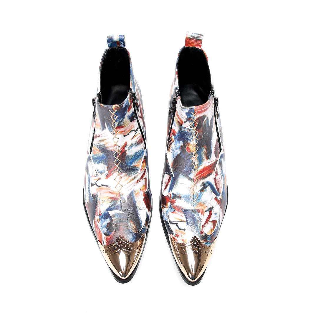 A pair of men's abstract print ankle boots with a gold metal cap toe and side zipper, shown against a white background.