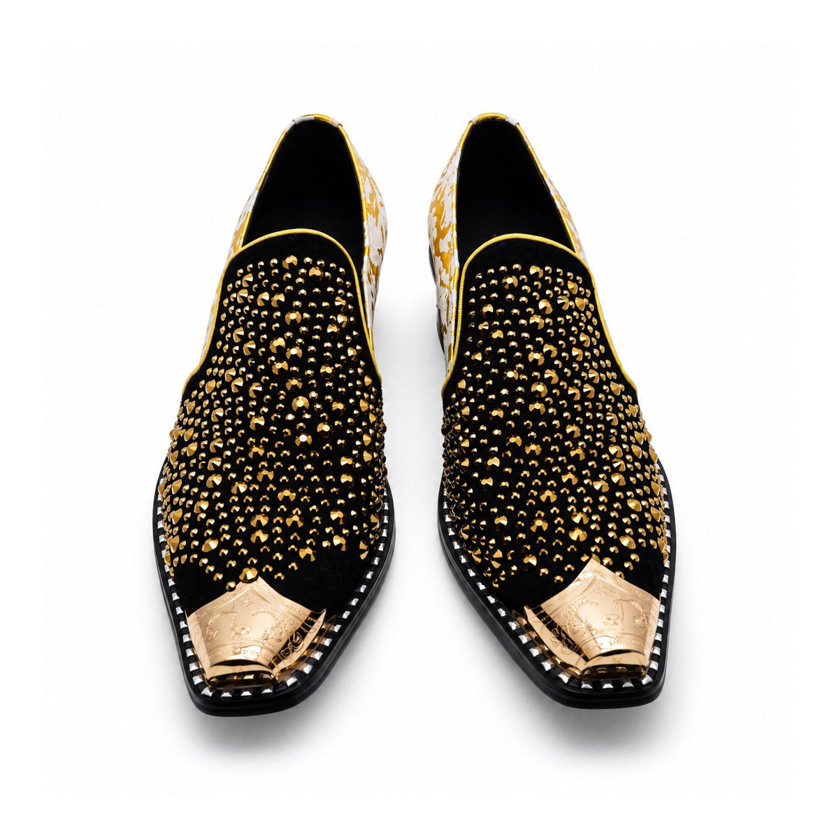 A pair of men's black studded loafers with a gold metal toe cap, a gold and grey patterned upper, and a crystal-embellished