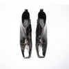 Pair of shiny black square toe ankle boots with metal tip and block heels