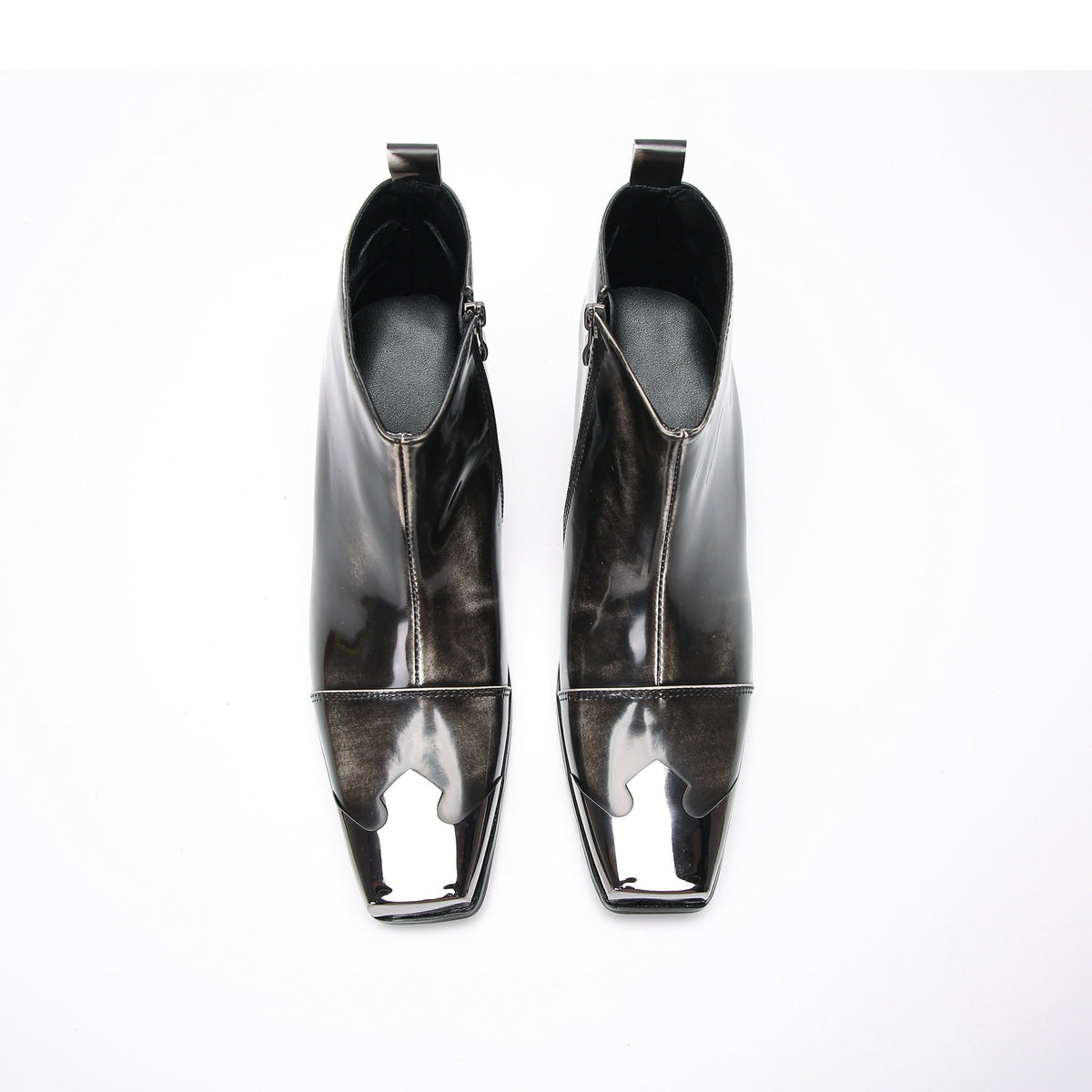 Pair of shiny black square toe ankle boots with metal tip and block heels