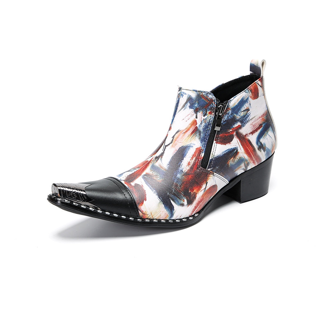 Pair of men's abstract print ankle boots with black leather pointed toe and metal tip, side zippers, and black block heels.