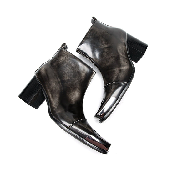 Pair of shiny black square toe ankle boots with metal tip and block heels
