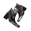Pair of shiny black square toe ankle boots with metal tip and block heels
